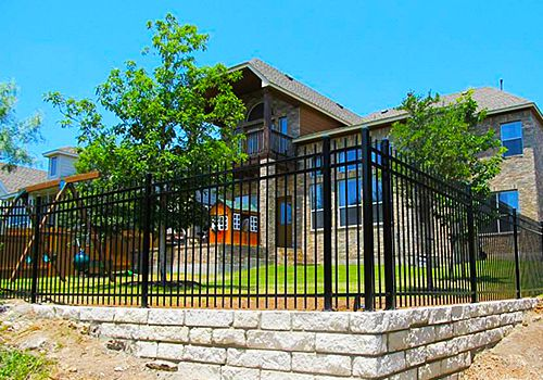 ornamental iron fence installation for austin residences